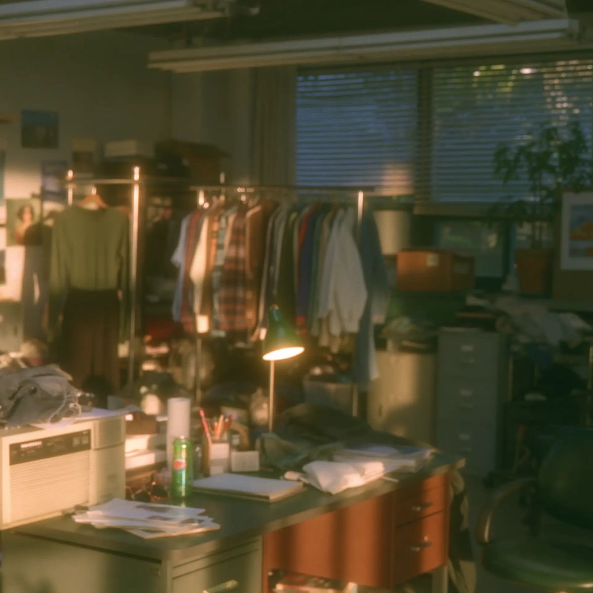 Costume department wardrobe rail and desk at golden hour
